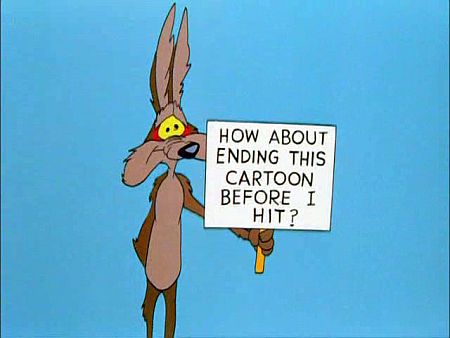 Wile E. Coyote holdign sign