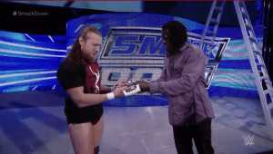 …and hand it over again, this time to Daniel Bryan…